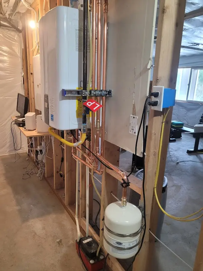 Licensed plumber repairing a kitchen sink in Millinocket